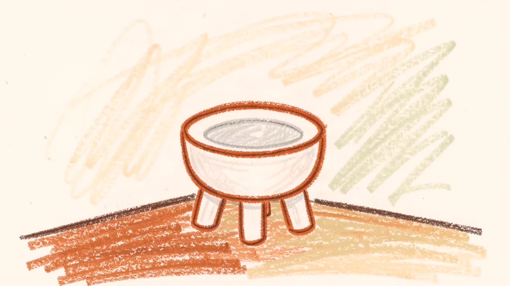 A child's crayon drawing of a small white potty on a bathroom floor, drawn with thick waxy crayons